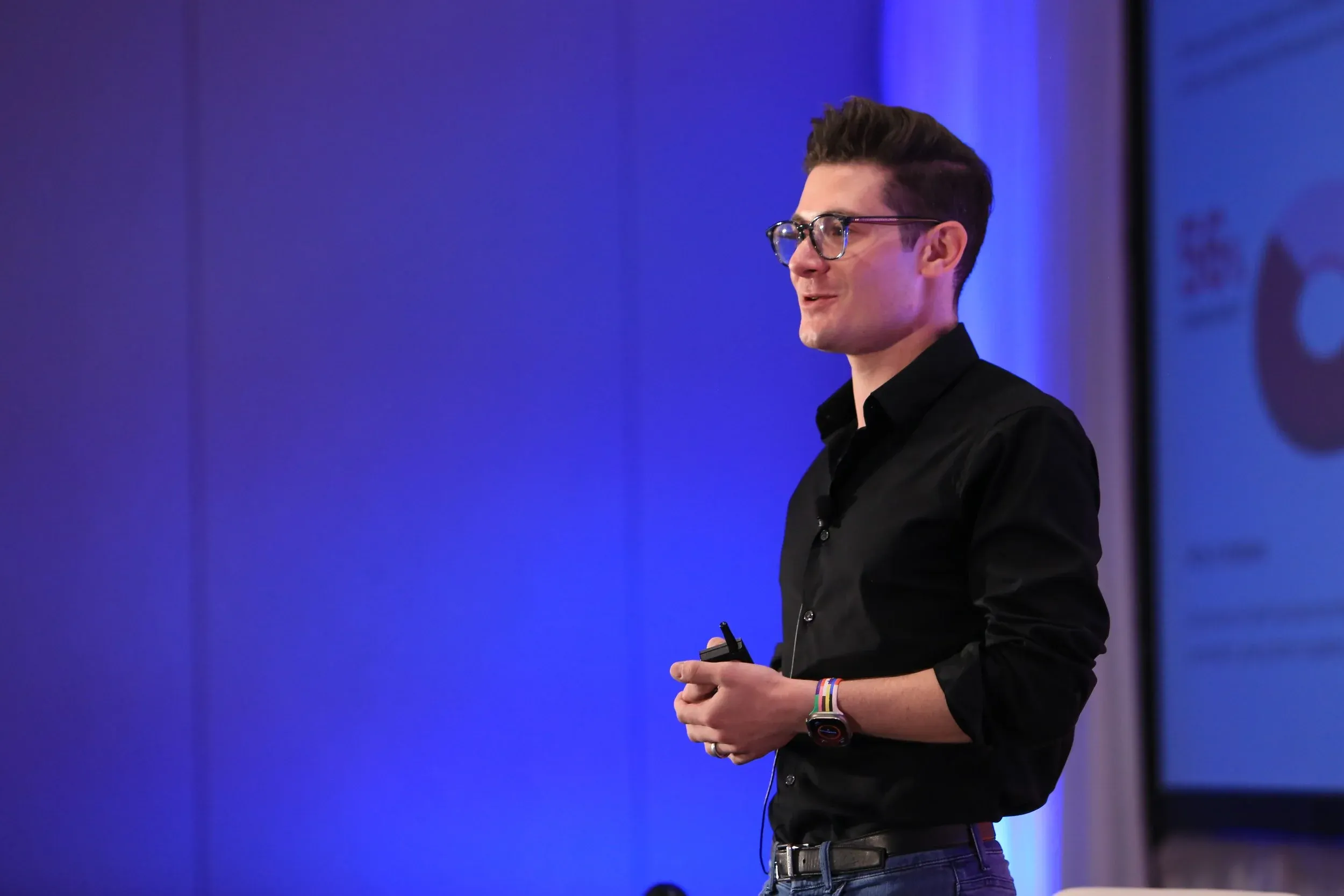 Brennen Bliss presenting on stage at a travel industry conference